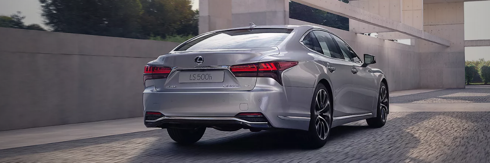  Rear view of a Lexus LS driving.