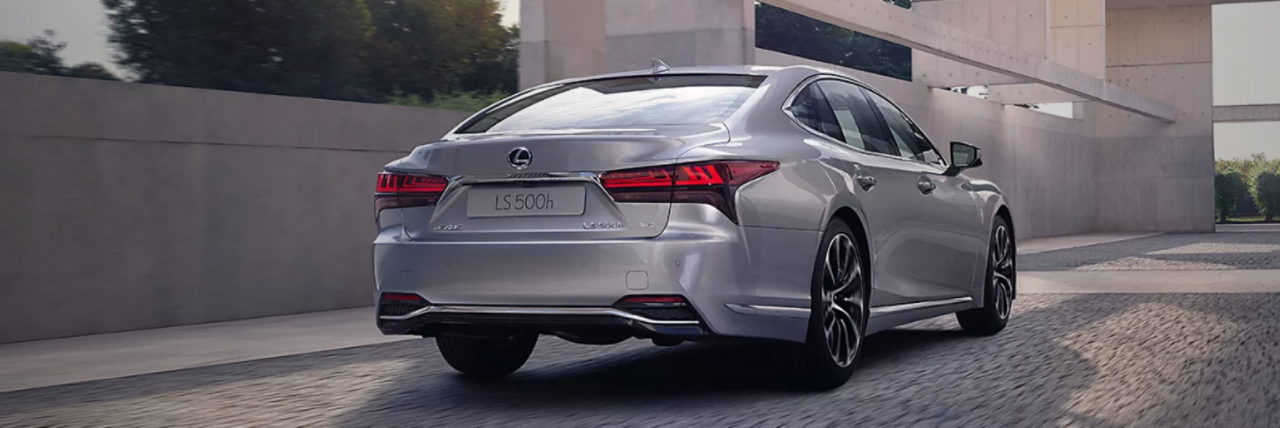 Rear view of a Lexus LS driving.