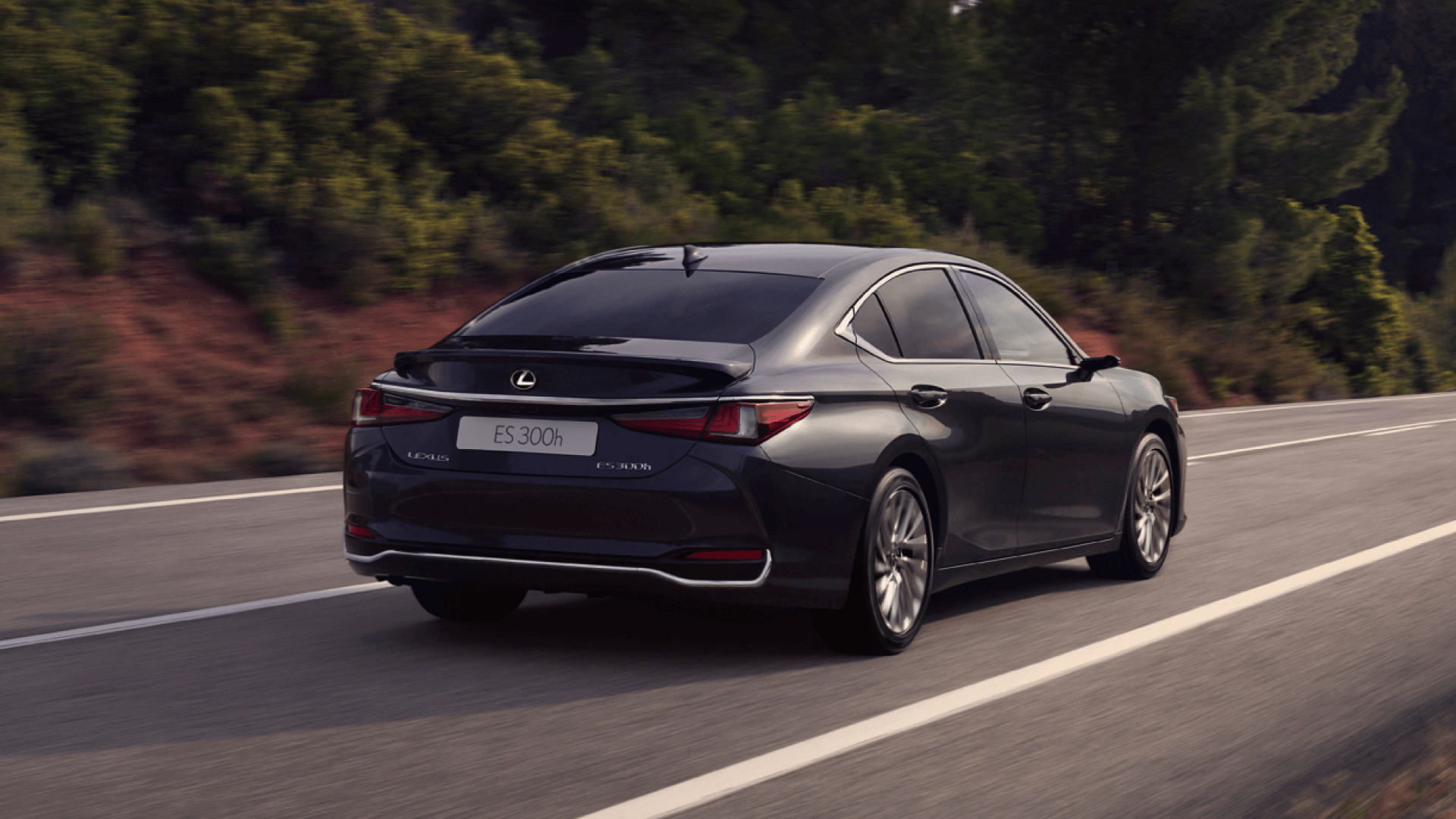 Rear view of a Lexus ES driving on a road