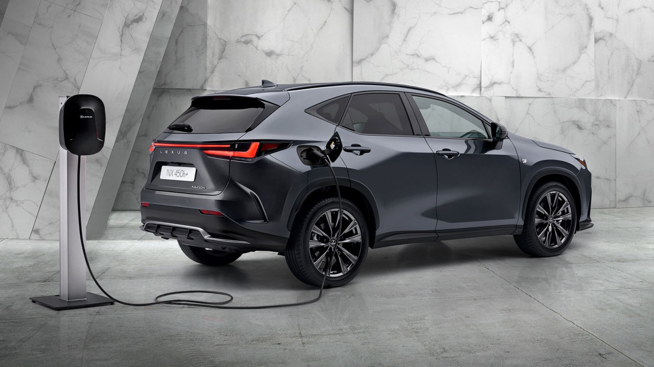 Lexus NX 450+ plugged into a charging tower 