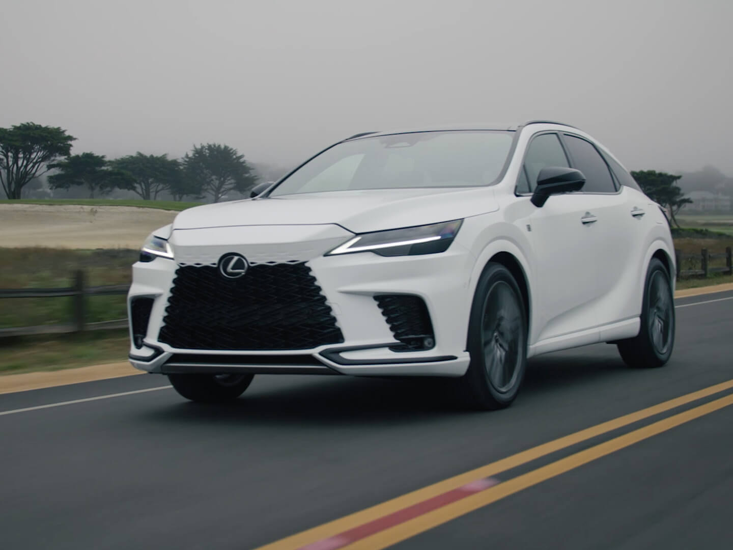 The Lexus RZ driving on a road