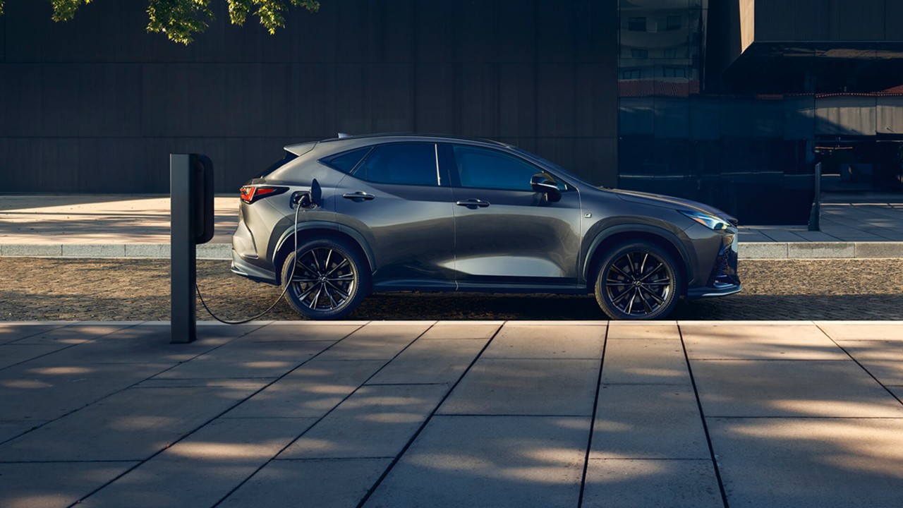 Lexus NX plugged into a charging tower
